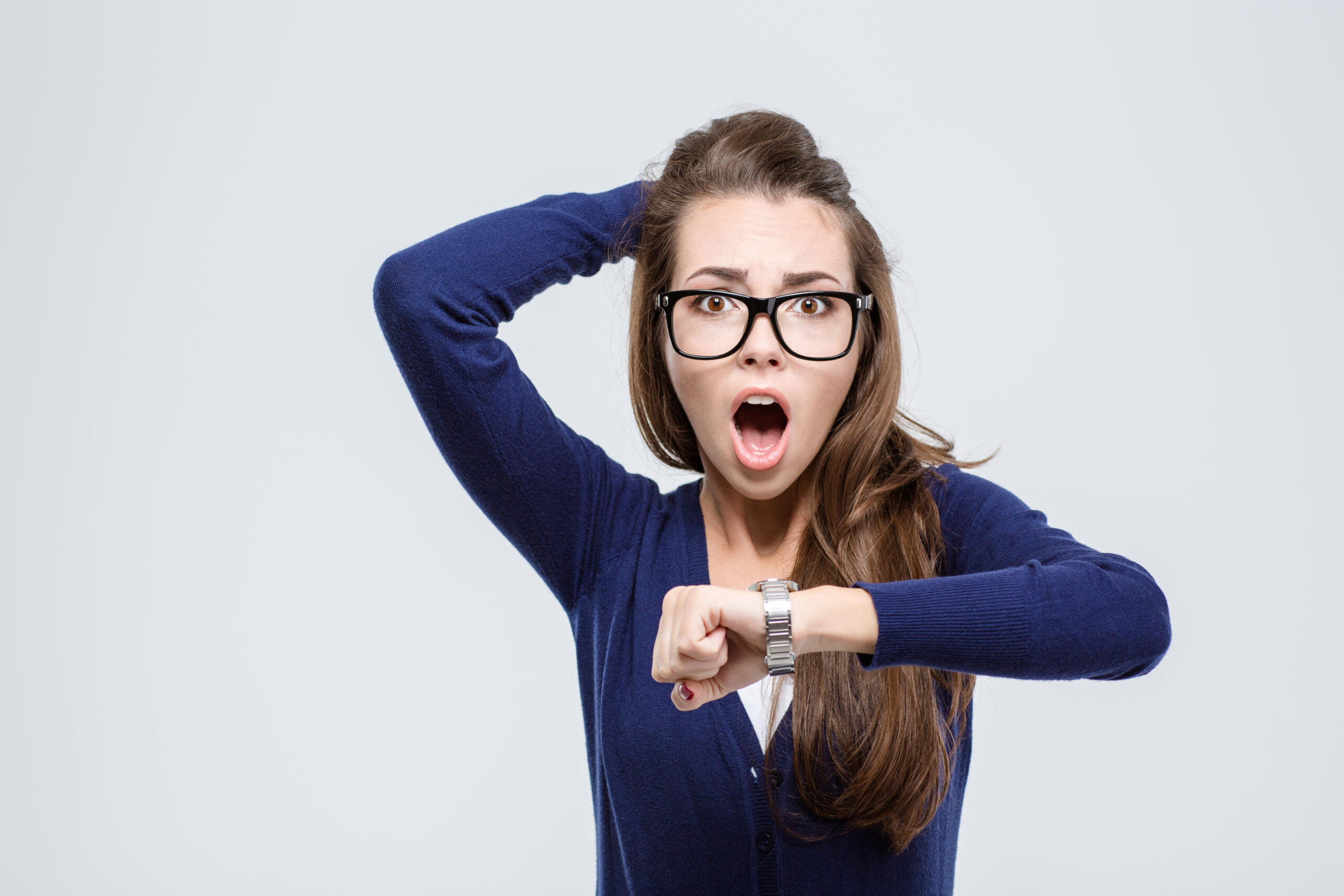 Portrait,Of,Shocked,Young,Woman,Holding,Hand,With,Wrist,Watch